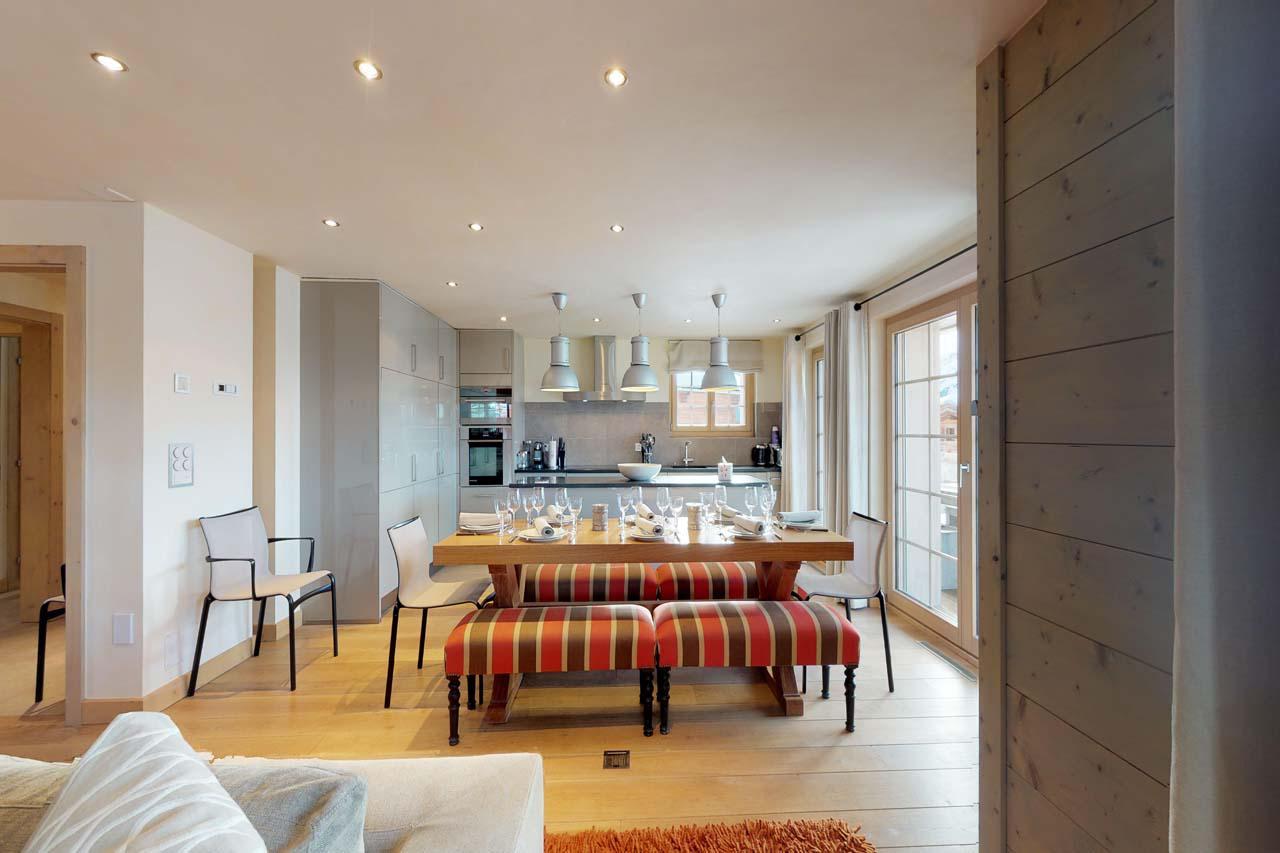Dining table with space to accommodate ten guests at Chalet Albert-Luc in Verbier