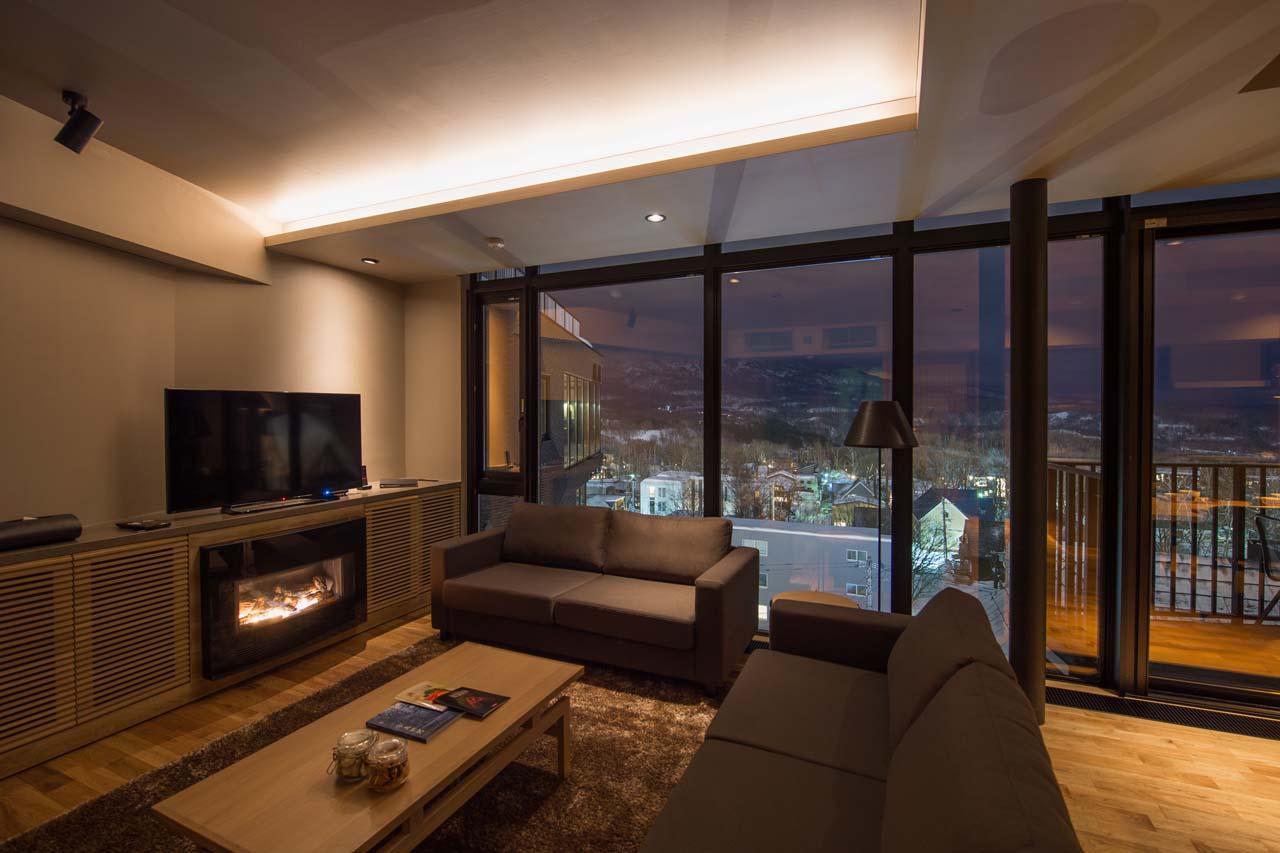 Fireplace and access to balcony at Apartment Aspect 2 in Niseko