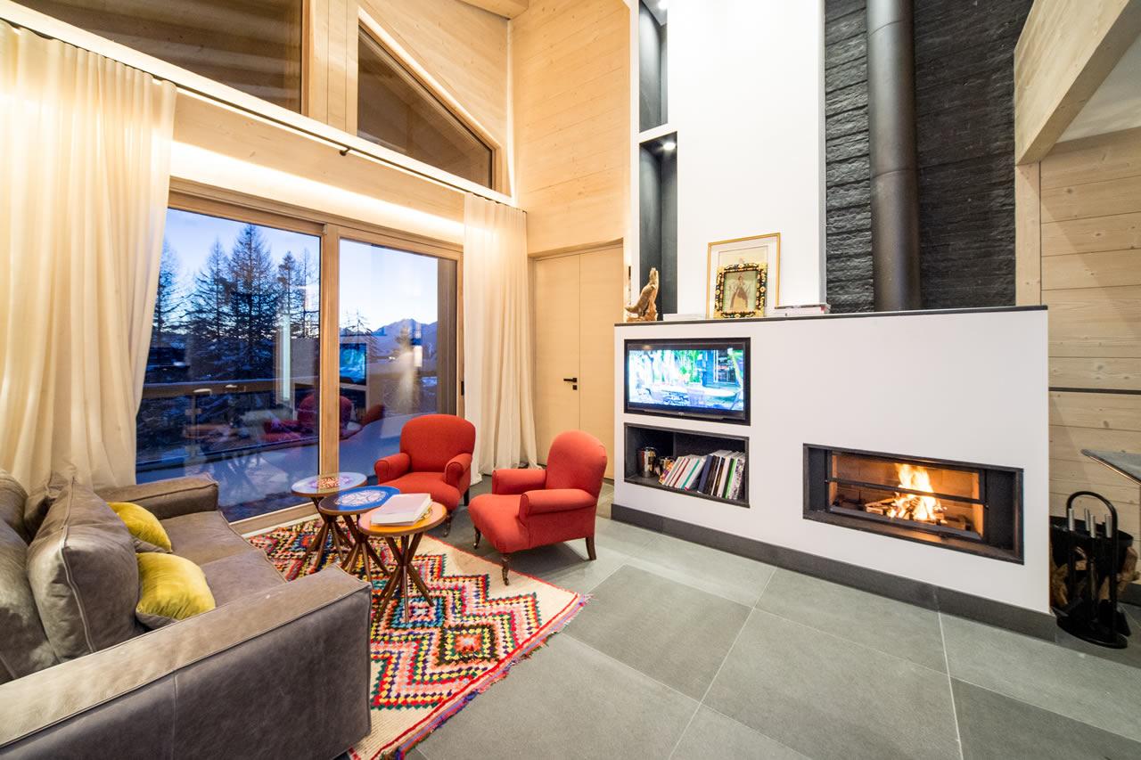Apartment Bellalui in Crans-Montana with double height living room with fireplace