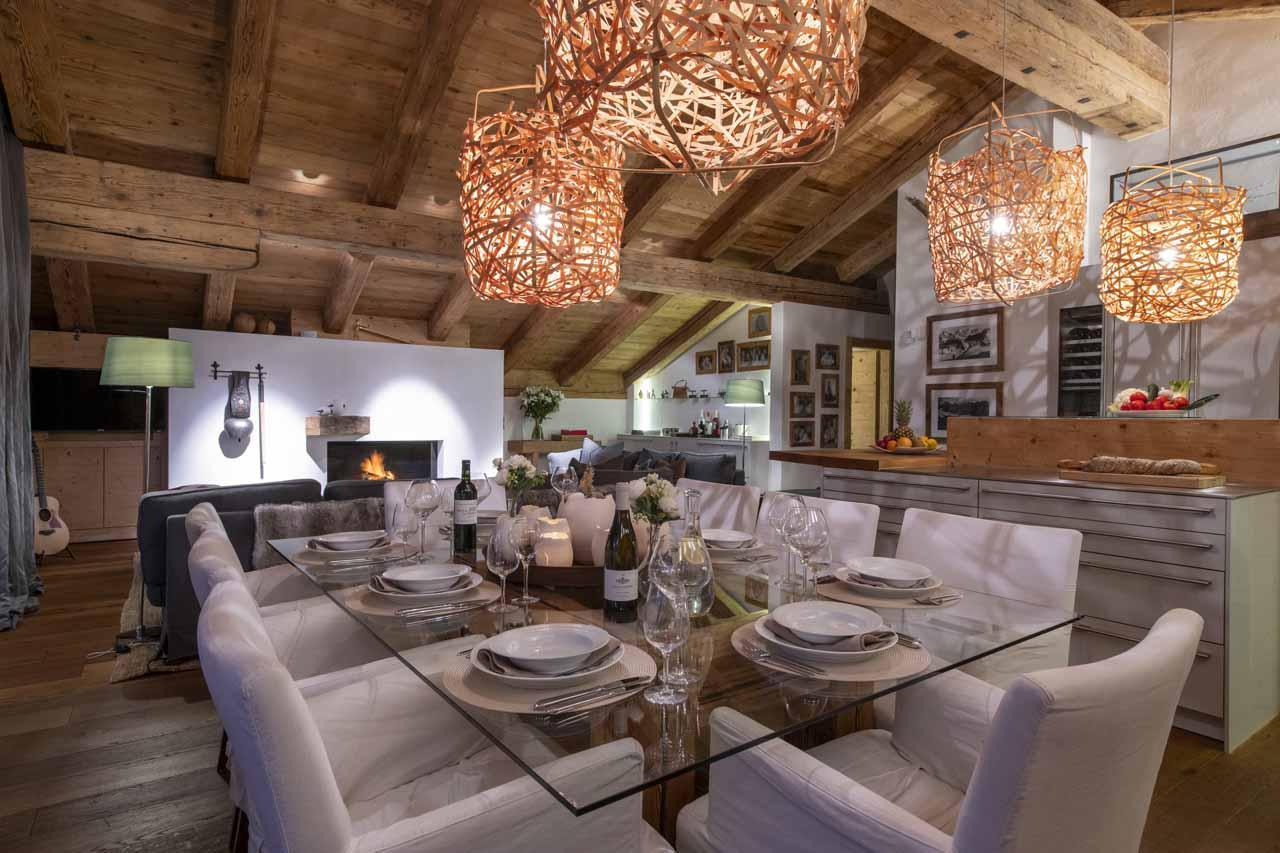 Dining table in open-plan living area in Basalte Penthouse, Verbier