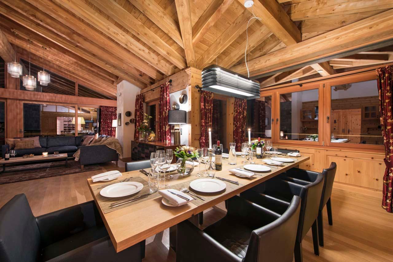 Dining area at night of Chalet Alex in Zermatt