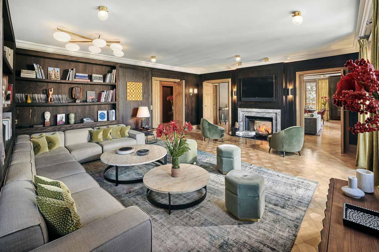 Living area with inviting fireplace in Chalet Alpensia in Courchevel 1850