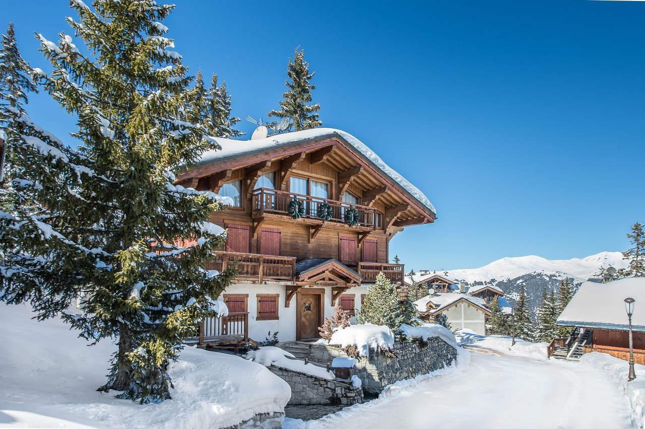 Exterior of Chalet Aspen in Couchevel 1850 with large balcony on first floor