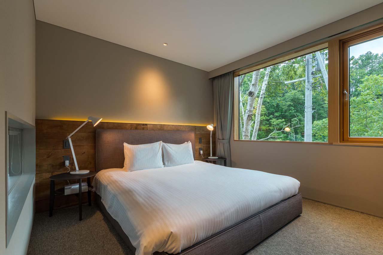 Large double bedroom with en-suite bathroom at Chalet Boheme in Niseko