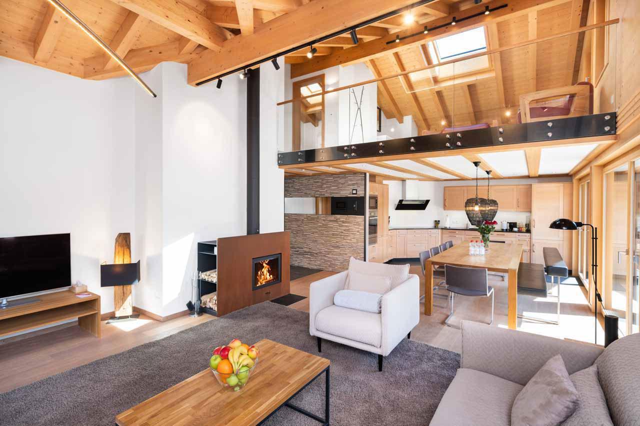 Large living area with fireplace at Chalet Columba at Grindelwald