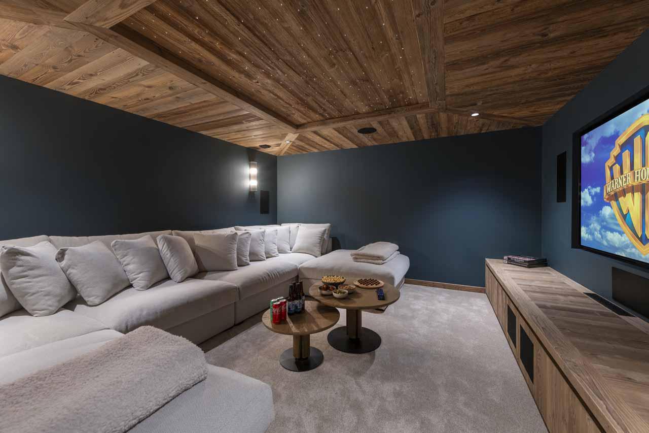 Cinema room with wrap-around sofa in Chalet Fika, Les Gets