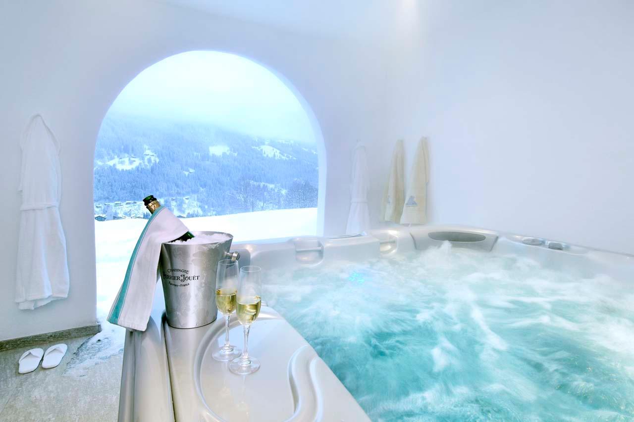 Covered outdoor hot tub at Chesa Falcun in Klosters