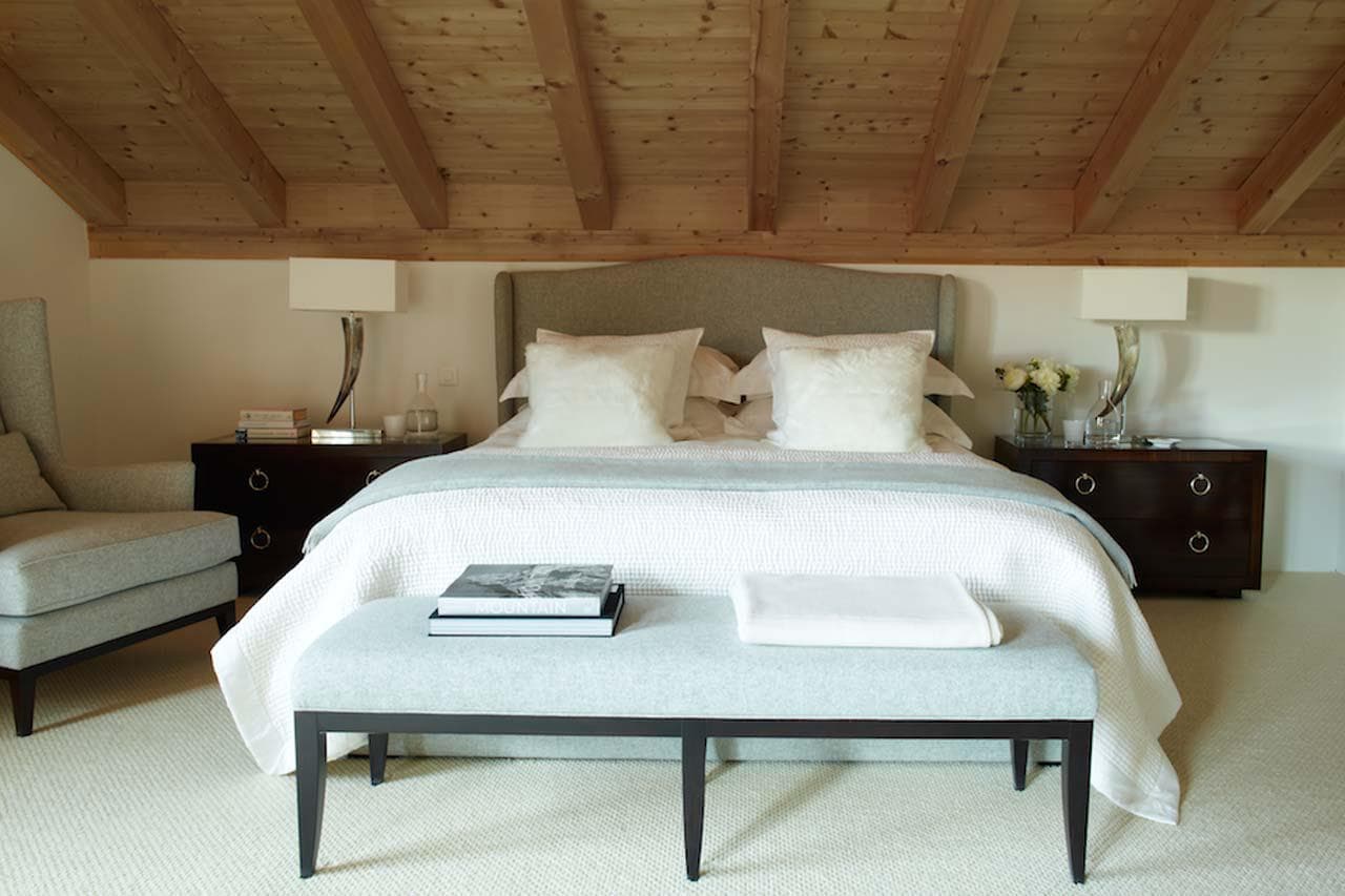 Spacious master bedroom with vaulted ceiling in Haus Alpina in Klosters