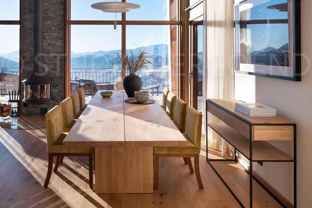 Dining area with windows framing exceptional panoramic views at Eden Mille 8 in Les Arcs