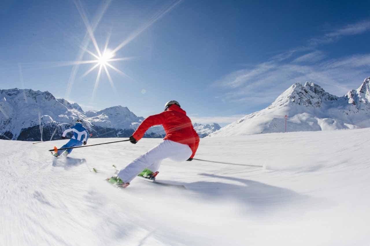 Skiing on piste in St Moritz on a sunny day