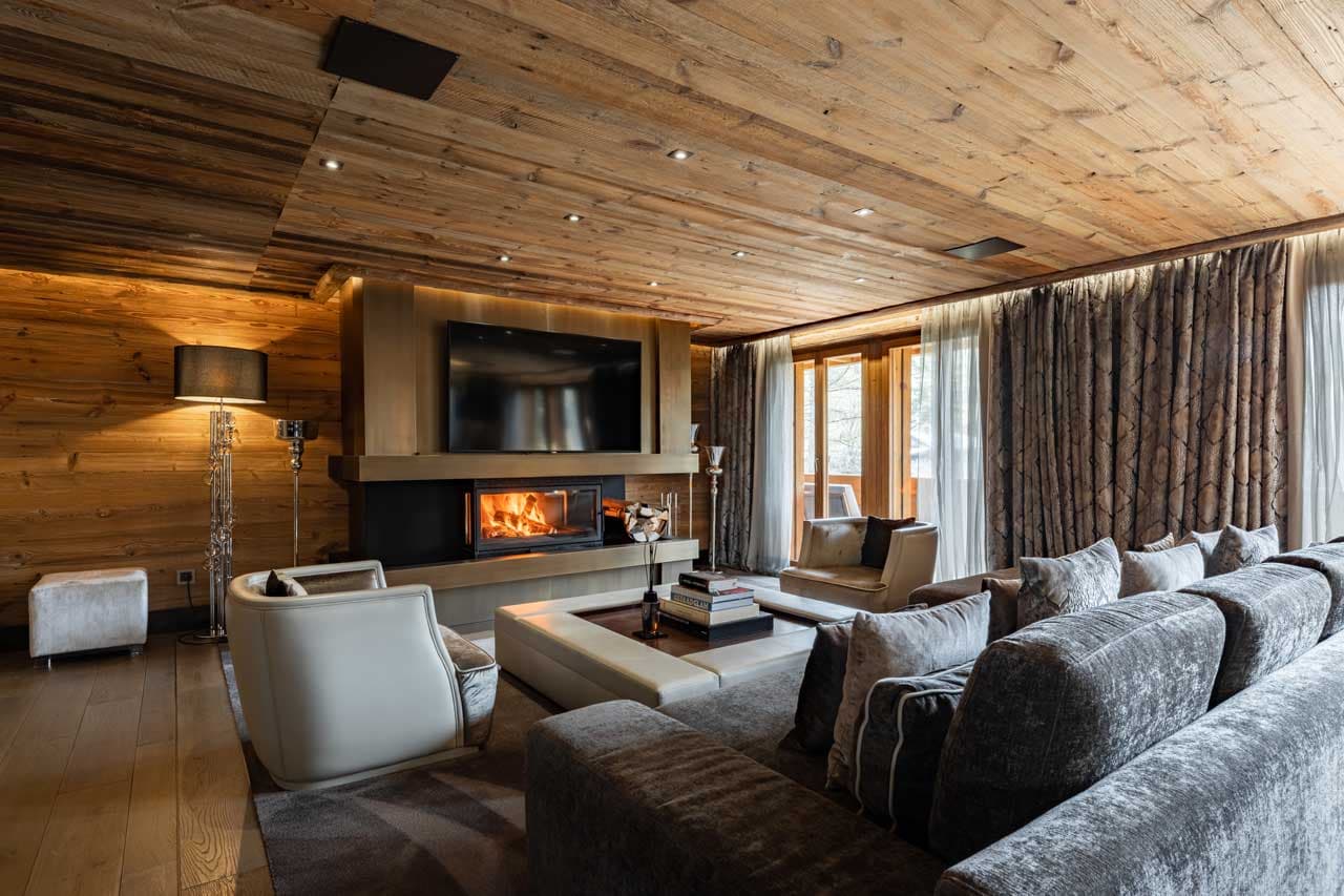 Fireplace in living area of Ultima Gstaad 3BR Residence in Gstaad